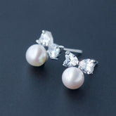 Graceful Bow Pearl Studs - Blinglane